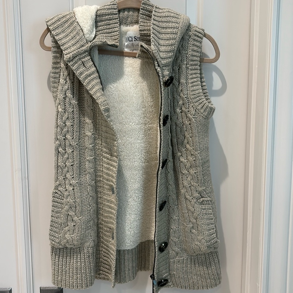 Knit vest fully lined with soft thick fleece.